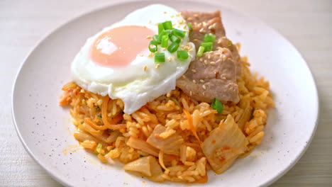 kimchi fried rice with fried egg and pork - korean food style
