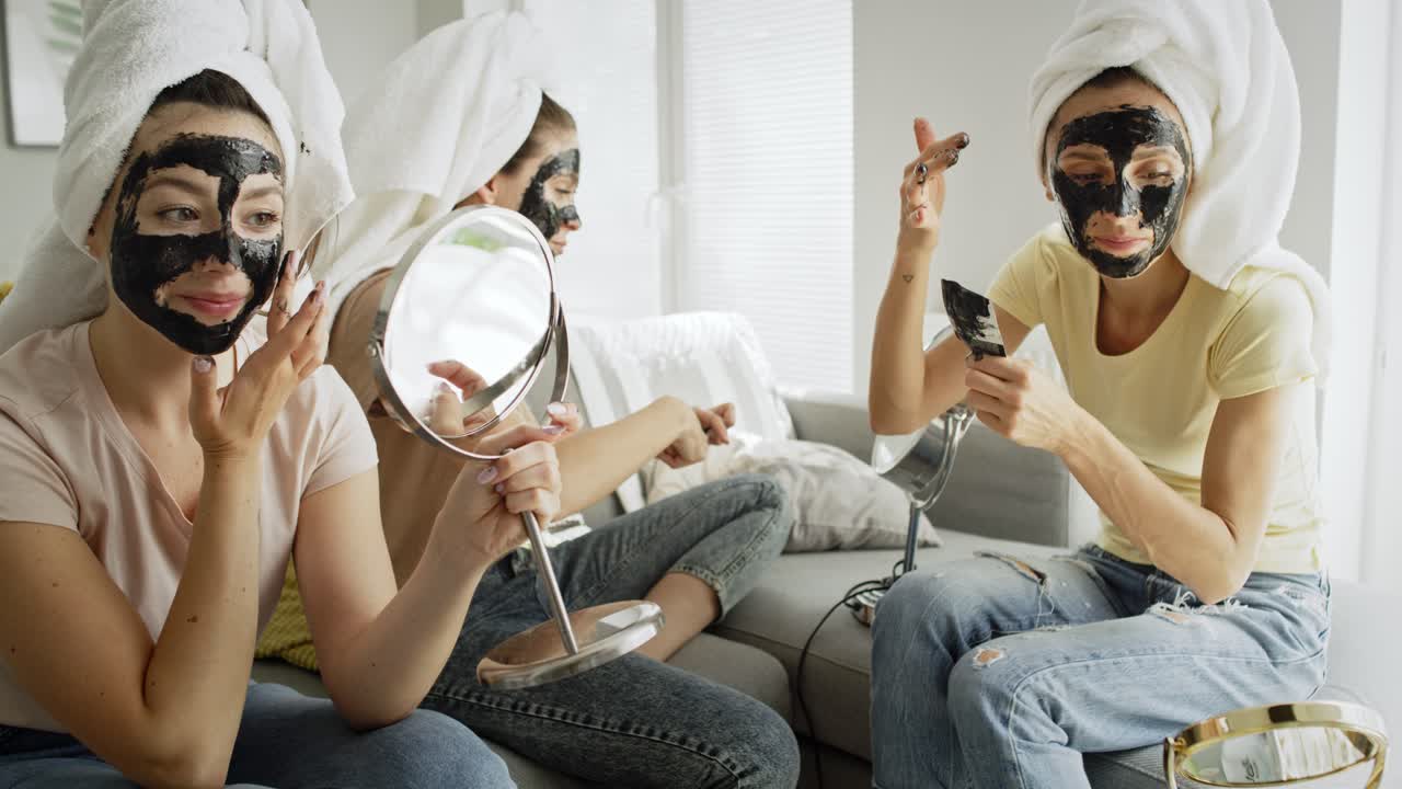 Video of three women applying facial mask at home