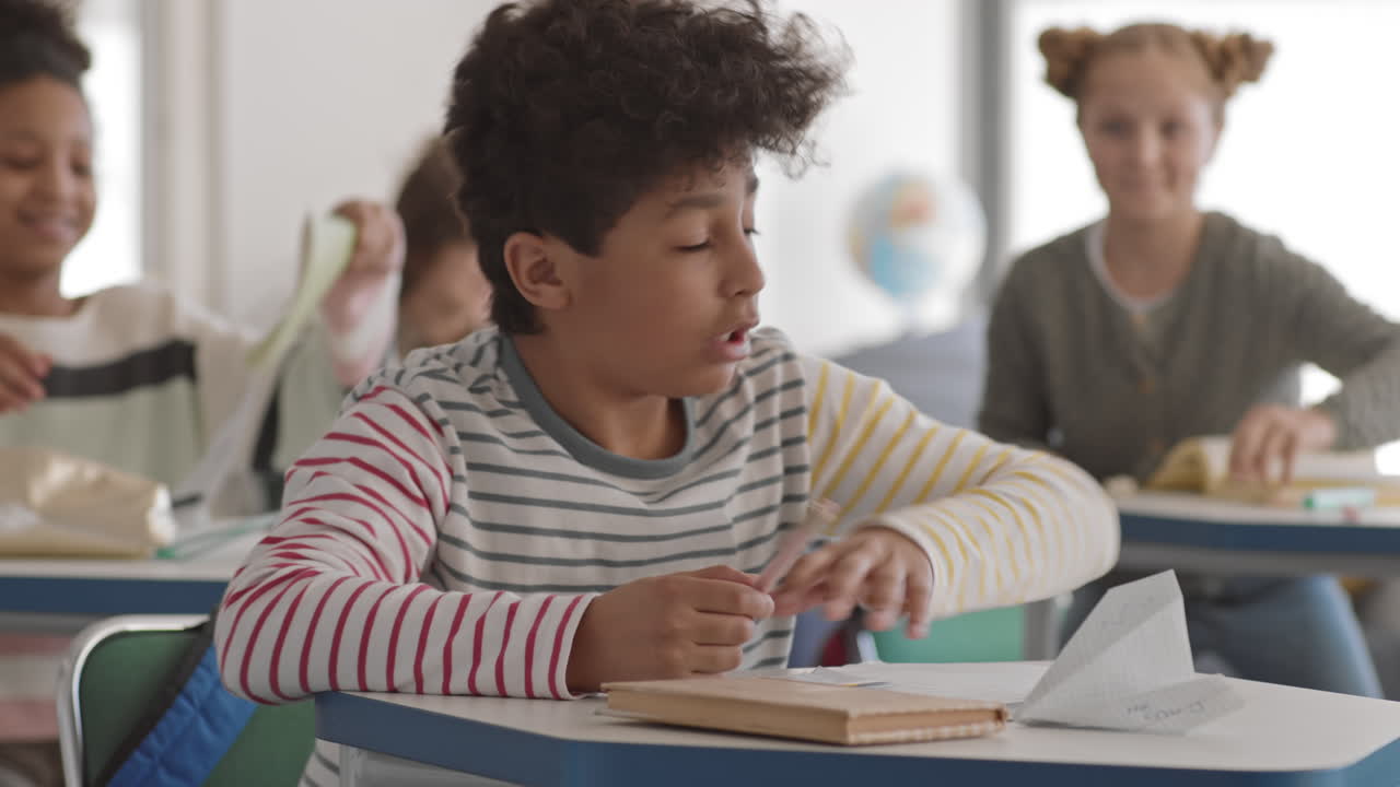 Mixed-Race School Boy Napping in Class
