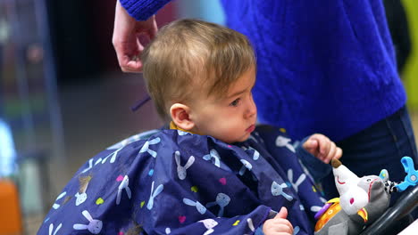baby getting a haircut