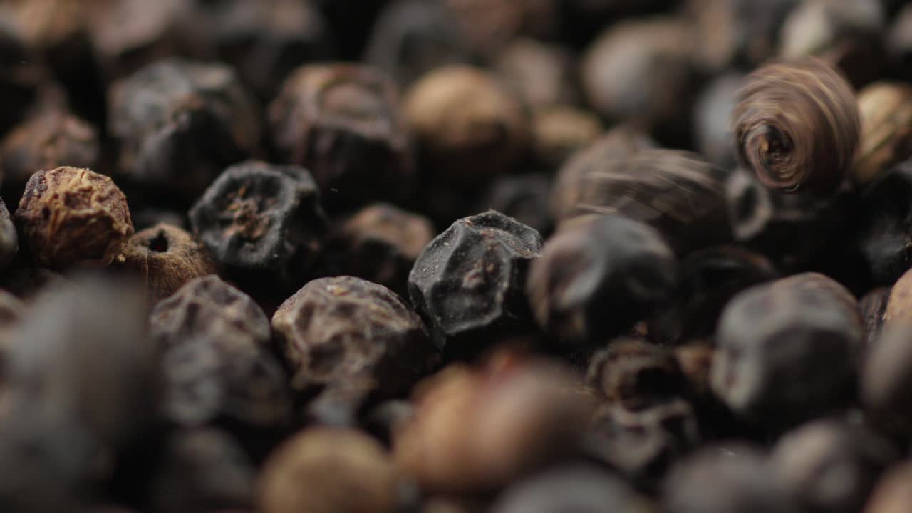 Dried Black Peppercorns Falling, Extreme Close Up Of Pepper Spice Seeds