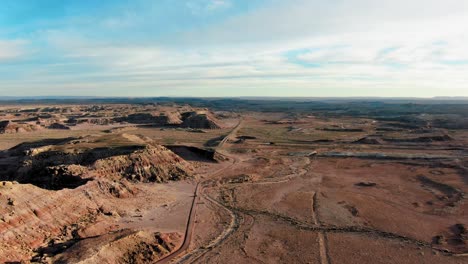 Aerial-Above-Secluded-Interstate-Roads-Crossing-In-Dry-Buttes-Desert