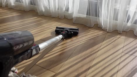 cordless vacuum cleaner on wood floor