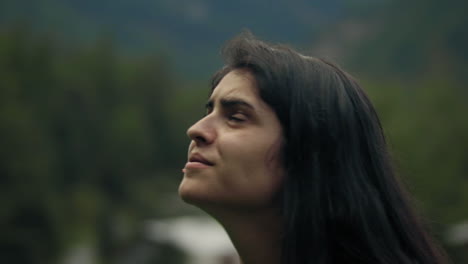 Close-Up-Arc-Shot-of-Young-Woman-in-the-Alps-Switzerland