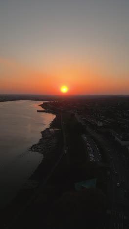 stunning sunset colours in clontarf co.dublin - ireland 4k vertical cinematic drone footage 06