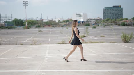 woman walking in a parking lot