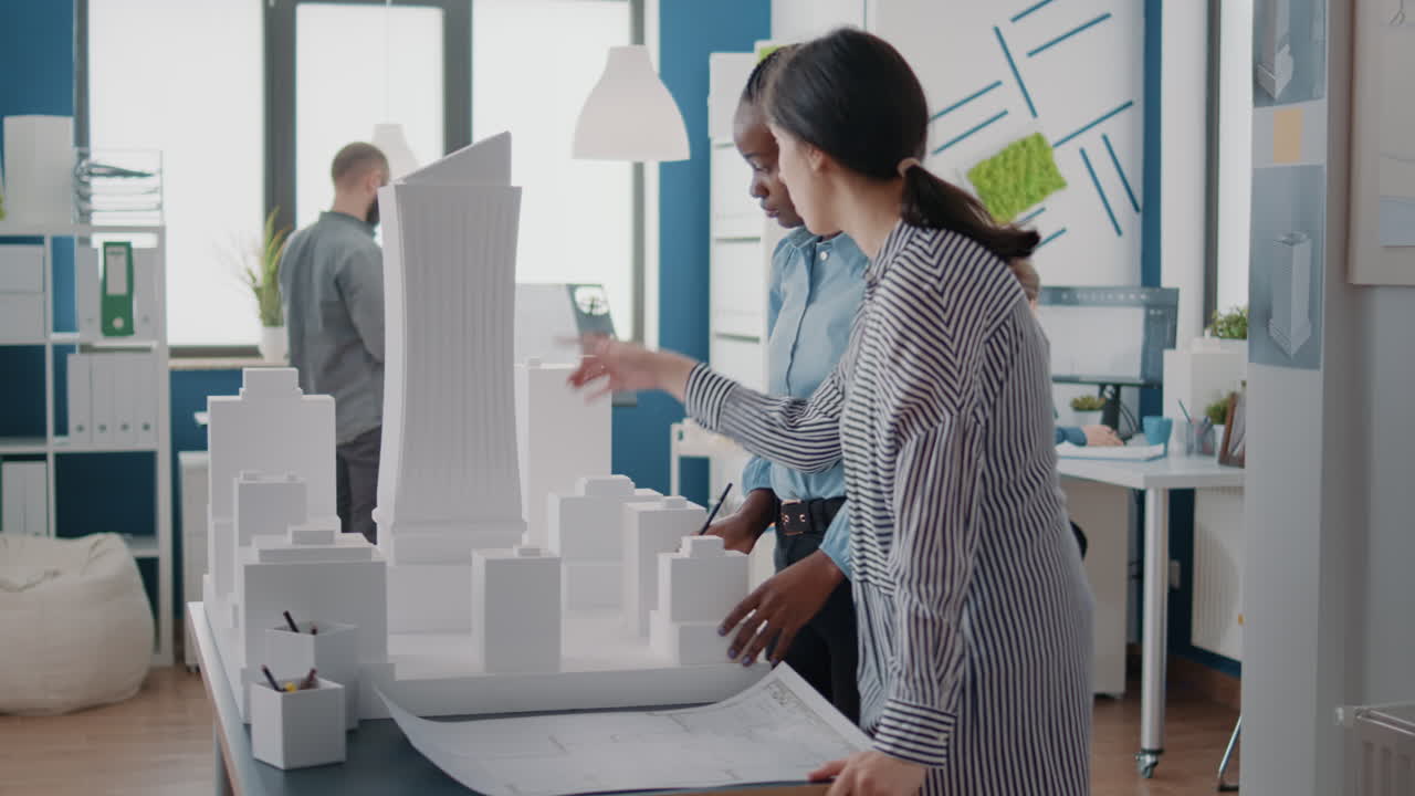 Architects Discussing Building Model