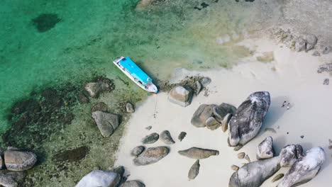 aerial top down of indonesian boat anchored on