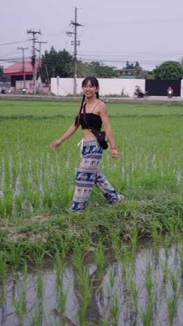 woman walking in a rice field