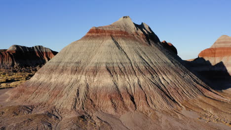 Arizona-Landscape:-Colorful-teepees-of-Painted-Desert-with-blue-sky---drone-tracking-shot