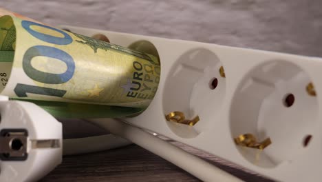 high electricity prices concept.money. euro cash. socket.