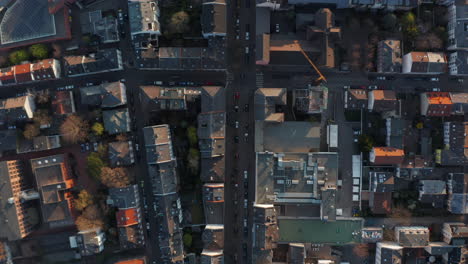 Aerial-birds-eye-overhead-top-down-view-of-buildings-and-streets-in-urban-neighbourhood.-Vertical-panning.-Frankfurt-am-Main,-Germany