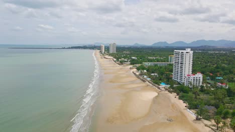 aerial view of a tropical beach with high-rise buildings