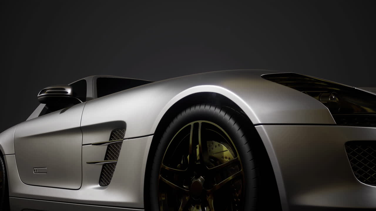 Sleek silver sports car elegantly displayed under dramatic lighting
