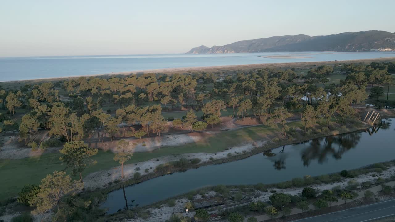 aerial view over troia island of Portinho da Arr&aacute;bida a natural paradise in the background in Set&uacute;bal Portugal