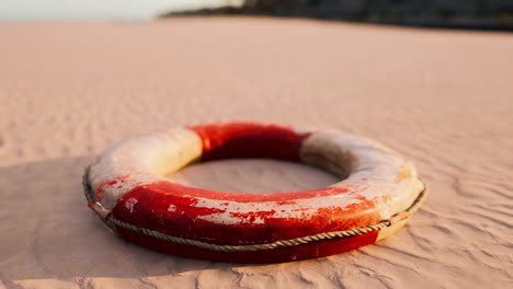 old lifebuoy on a sandy beach