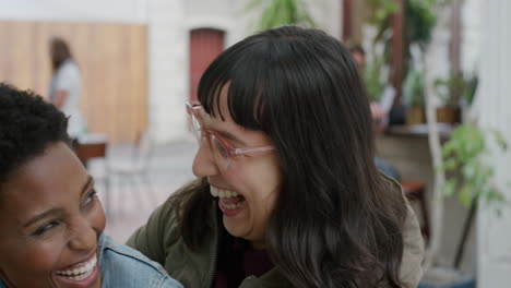 portrait of young woman suprise embracing friend diverse girlfriends hugging laughing enjoying friendship hang out together in urban background