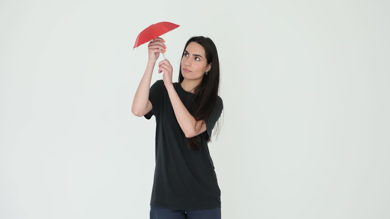 Woman posing with red umbrella