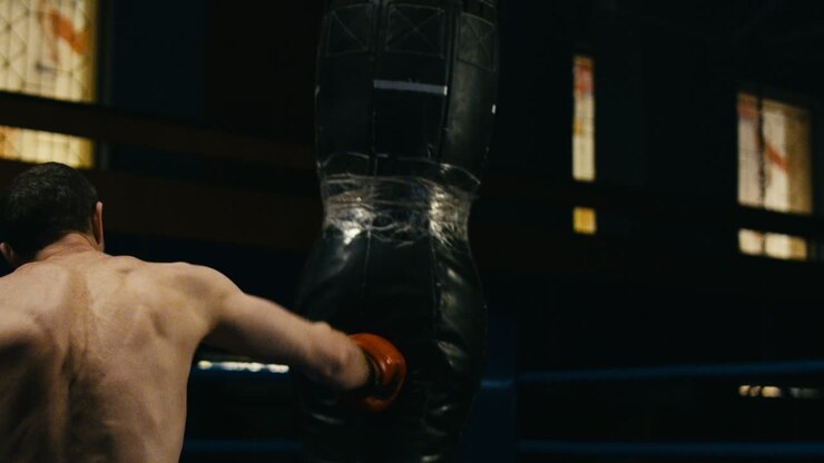 Man practicing martial arts in a gym