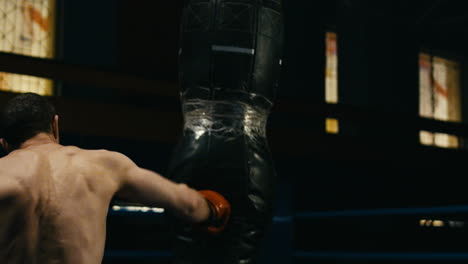 man practicing martial arts in a gym