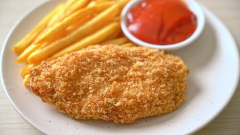 fried chicken breast fillet steak with french fries and ketchup