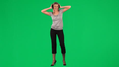 young woman listening to music with a headset on footage