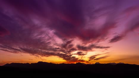 sunset motion time lapse with mountain silhouettes and beautiful purple orange colors, movement is done with gimbal, filmed in ronda, malaga, spain amazing 4k footage