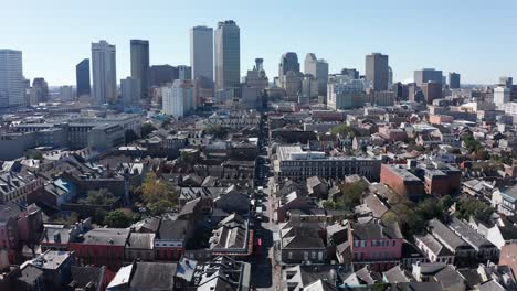 reverse pullback aerial shot of bourbon street during the day in the french quarter of new orleans