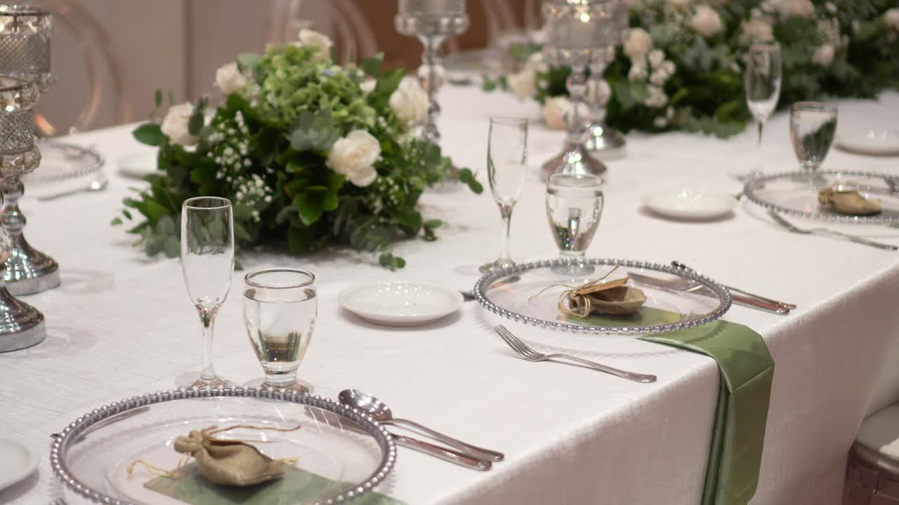 Wedding table setting decorated with fresh flowers