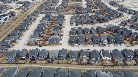 aerial view of a modern suburban community in calgary, canada, in spring after the snow melt