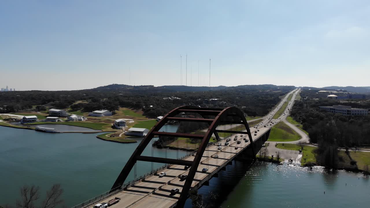 Aerial Austin Pennybacker Bridge - pulling up and away from the bridge and then panning down to reveal overlook area