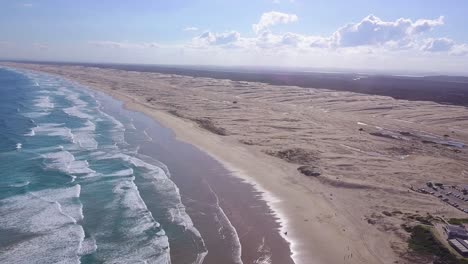 flight above the sanddunes of newcastle, australia
