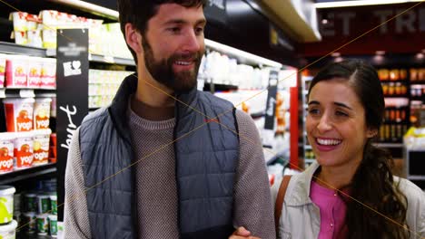 happy couple walking in grocery section