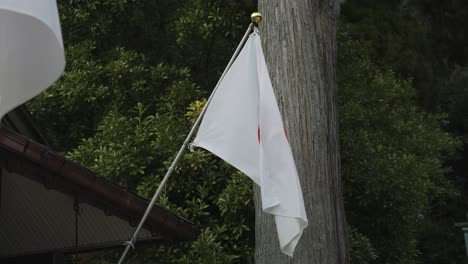 japanese flag flying slack in the wind