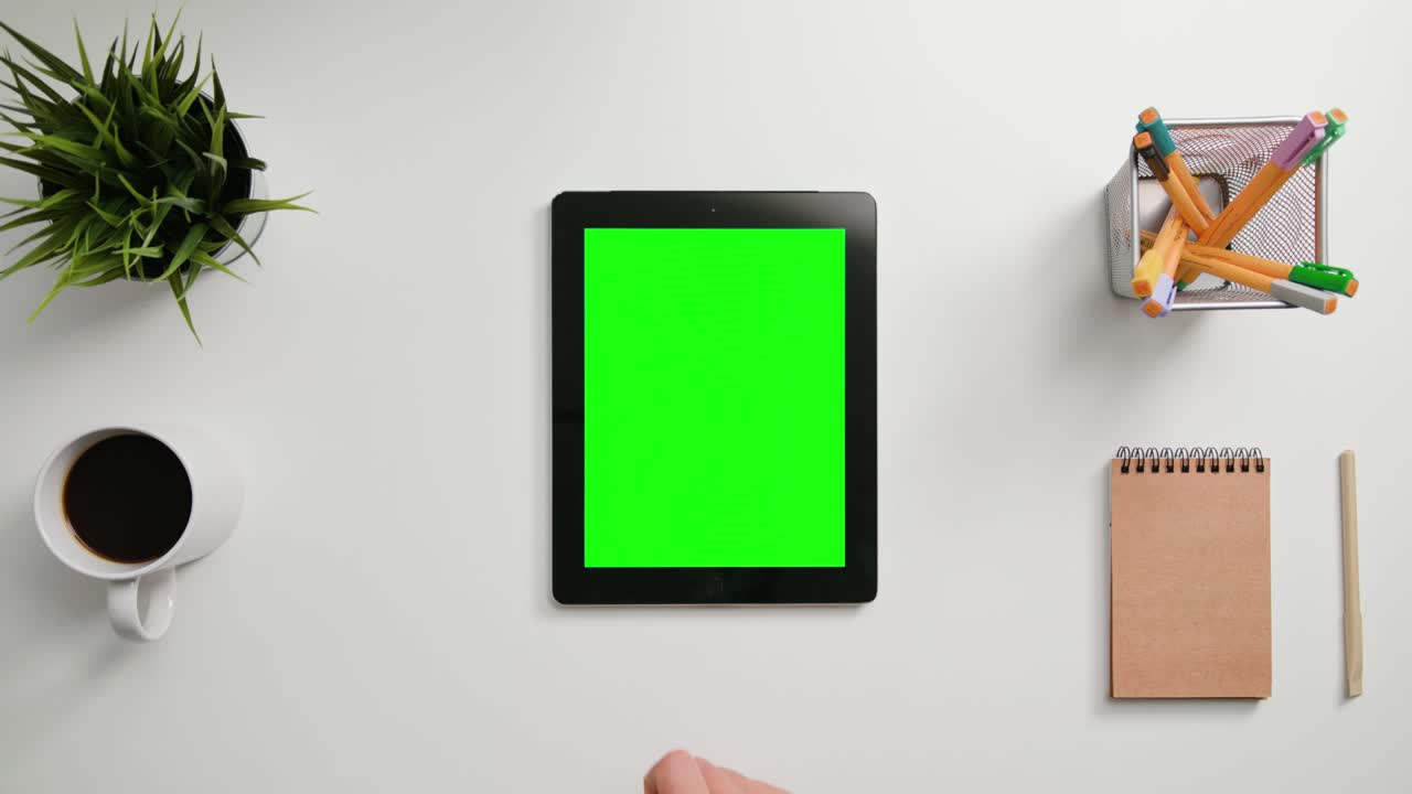 A Finger Scrolling on the Green Touchscreen