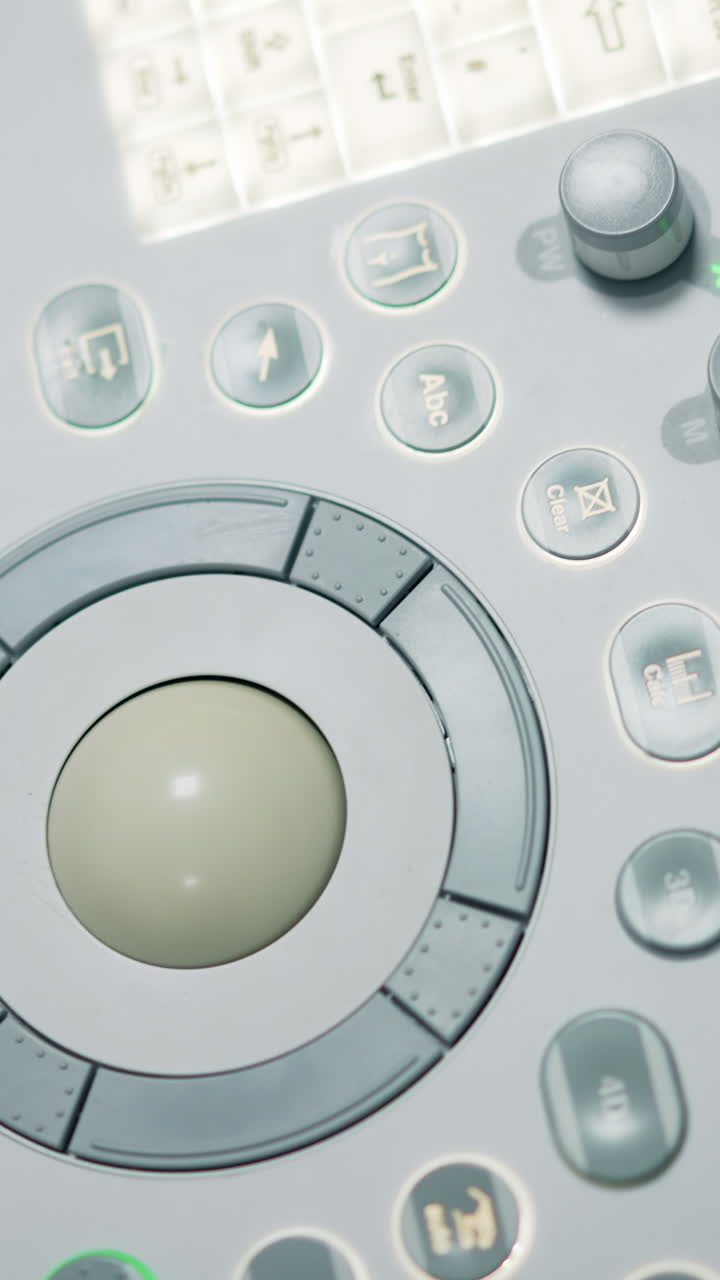Diverse buttons and keys on the medical apparatus. Close up. Sensor keyboard on the sonography diagnostic equipment from top.