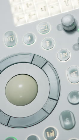 diverse buttons and keys on the medical apparatus. close up. sensor keyboard on the sonography diagnostic equipment from top.