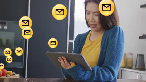 holding tablet, woman surrounded by animated email icons