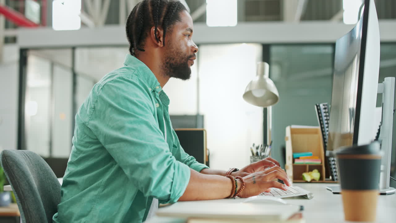 Tablet, computer and black man typing in office