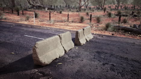 old-rusted-concrete-road-barrier-blocks