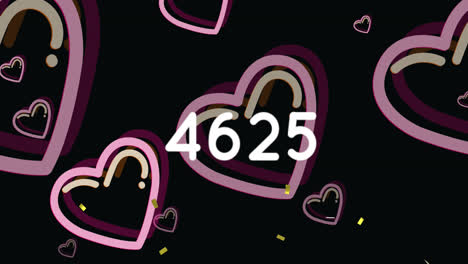 animación de confeti sobre números y iconos de corazón en fondo negro