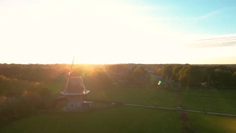 sunset over a dutch windmill