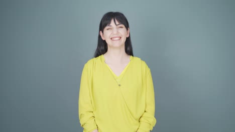 Woman-smiling-at-camera