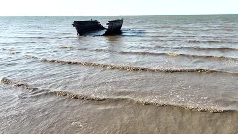 abandoned boat on serene pattaya shoreline