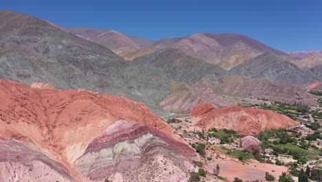 Cinematic-and-panoramic-drone-shot-of-the-Hill-of-Seven-Colors,-in-Jujuy-Province,-Argentina