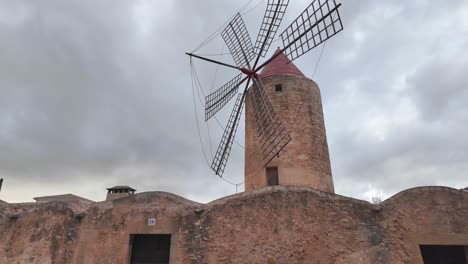 Windmill-in-Algaida,-traditional-architecture-with-dramatic-sky