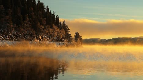 amazing orange light from sunrise over the jonsvatnet lake in norway