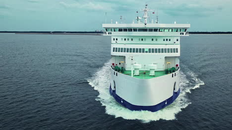 White-ferry-boat-sailing-straight-towards-the-camera-during-a-cloudy-day