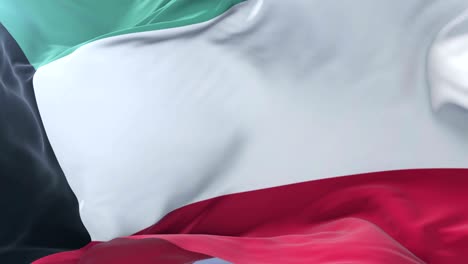 bandera de kuwait ondeando en el viento con el cielo azul en lento, bucle