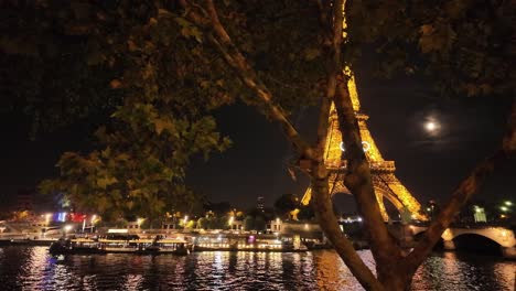 eiffel tower at night with olympic rings